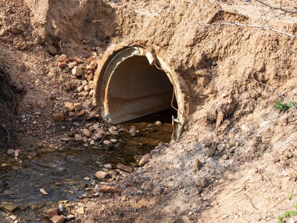 Water running through a rural culvert