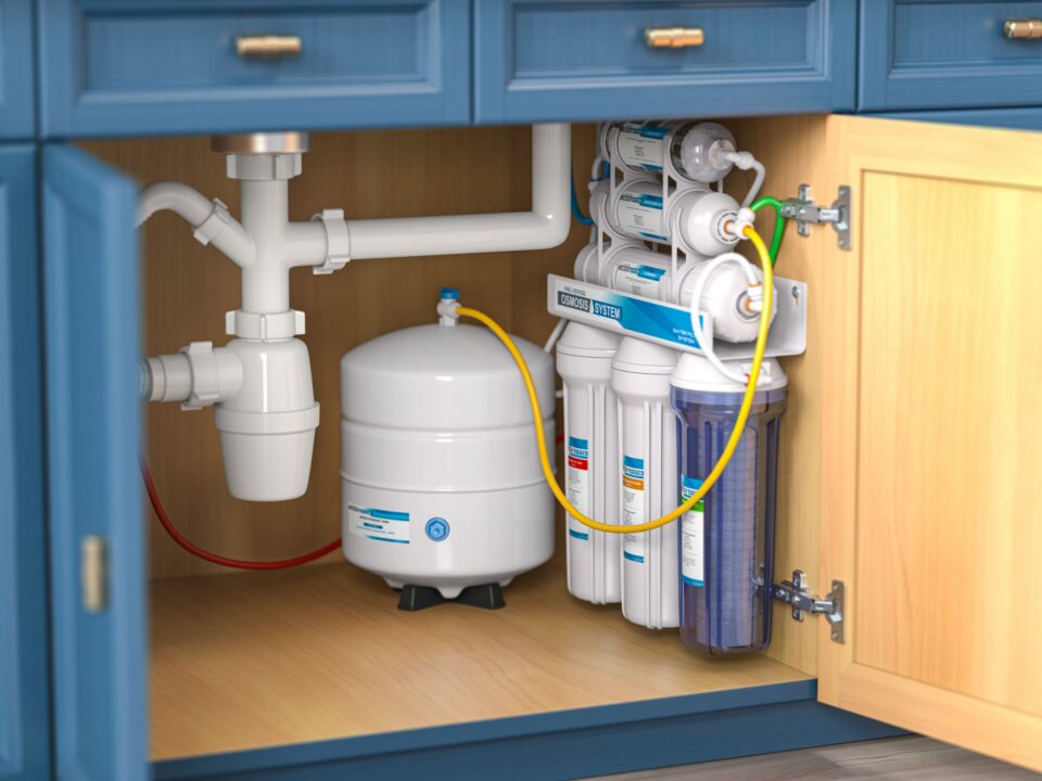Water filter installed under a kitchen cabinet